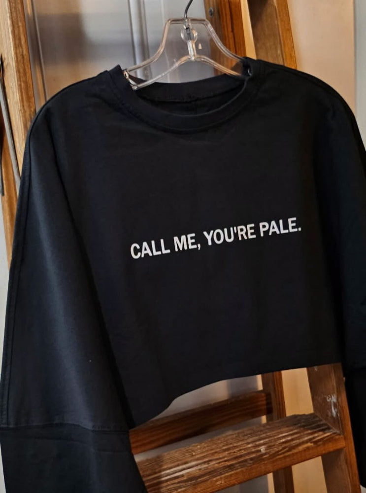 Show off your sunless tanning style with the CALL ME, YOU’RE PALE oversized cropped long sleeve by BakD Sunless.