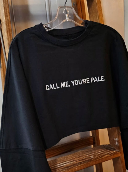 Show off your sunless tanning style with the CALL ME, YOU’RE PALE oversized cropped long sleeve by BakD Sunless.